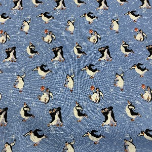 45” Wide 100% Cotton Penguins with Blue Background
