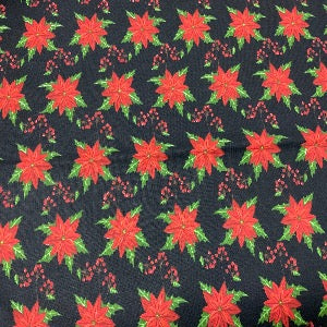 45” Wide 100% Cotton Poinsettias with Black Background