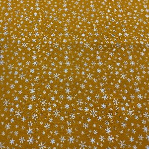 45” Wide 100% Cotton Snowflakes with Mustard Background