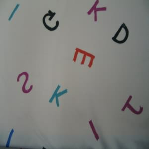 45" China Silk 100% Polyester Letters Multi with Pink Background
