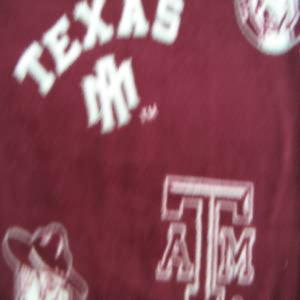 60" Fleece 100% Polyester Texas A & M University Aggies Allover with Maroon Background