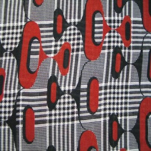 54" Polyester Black and White Checks with Rust Circles