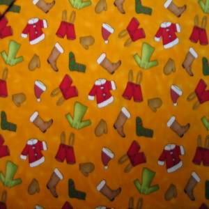 45" Christmas Moda Santa Clothes with Orange Background 100% Cotton