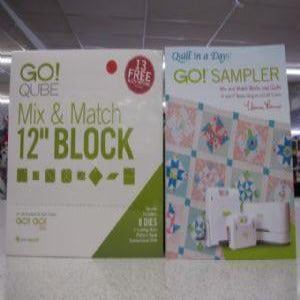 Accuquilt GO Qube Mix and Match 12" Block: Included in the Qube:(3) Go Mix and Match 6" X 6" Dies, (5) Go Mix and Match 10" X 10" Dies, 6" X 6" Cutting Mat, 10" X 10" Cutting Mat, Instructional DVD, Pattern Book and A Self Contained Storage System #55778